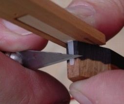 Cutting plectra to length 12K jpeg